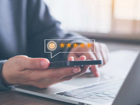 Customer service and Satisfaction Rating Concept. Customers choose a five-star smiley face on virtual screen over online application smartphone or the best service. feedback review, good quality.の写真素材