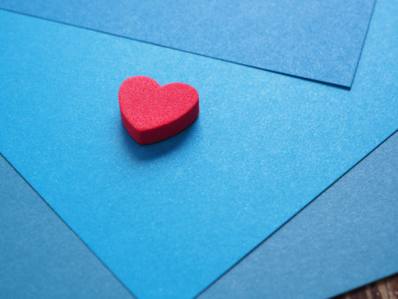 Empty gradient blue colored paper with red heart background texture.  Abstract geometric flat composition. The concept for image, text, and design, art, banner, wallpaper, backdropの写真素材