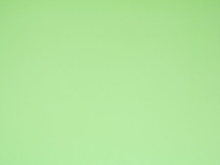 Empty green colored background texture. Blank green paper surface space for your image, text, art, design, and composition for banner, wallpaper, backdropの写真素材