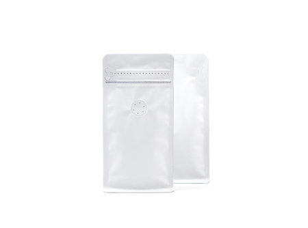 Two foil plastic paper bag packaging with vacuum-sealed, zipper for roasted coffee beans template isolated on a white background. Package mock-up for coffee or dry seeds product.の写真素材