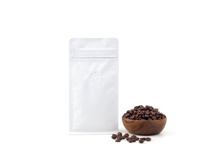 Foil plastic paper bag packaging with vacuum-sealed, zipper and wooden bowl for roasted coffee beans template isolated on a white background. Package mock-up for coffee or dry seeds product.の写真素材