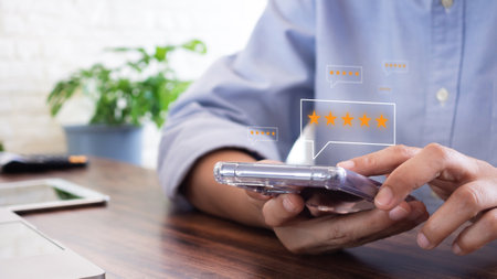 Customer service and Satisfaction Rating Concept. Customers send a five-star online application by smartphone, or the best service. feedback review, good quality.の写真素材