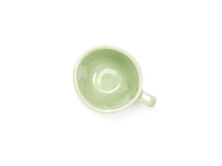 Empty green mug isolated on white background. Use for home or restaurant, food design. Concept kitchen utensils and tableware. Top view, flat lay.の写真素材