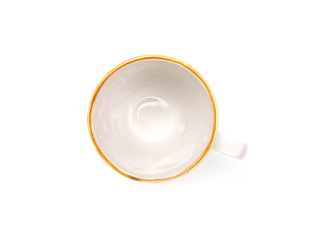 Empty white mug with brown rim isolated on white background. Use for home or restaurant, food design. Concept kitchen utensils and tableware. Top view, flat lay.の写真素材