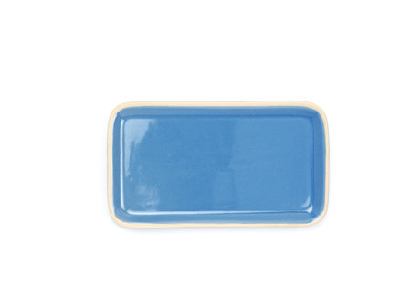 Top view, empty blue rectangle ceramic plate isolated on a white background. Use for home or restaurant, food design. Kitchen accessory.の写真素材