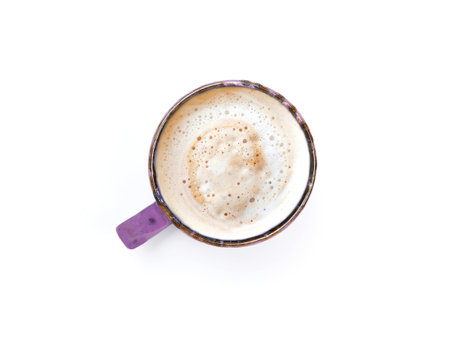 Top view, flat lay purple color coffee mug has cappuccino or latte with frothy foam isolated on a white background.の写真素材