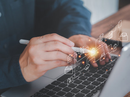 Businessman working on laptop with stylus pen shows the virtual screen with icon document data technology, efficient online storage. Big data technology and internet concept. Business background.の写真素材
