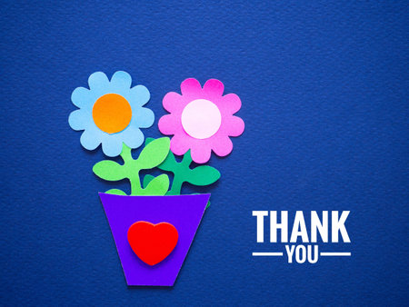 Paper flower in a pot and a red heart shape with a thank you message on a blue background. Ideas for positive, gratitude, greeting card, appreiate, congratulation, banner, feedback, support, thank youの写真素材