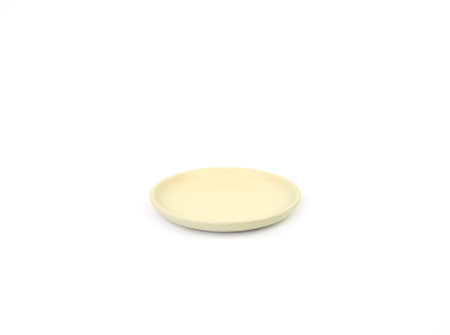 Empty beige round ceramic plate of sauce isolated on a white background. Use for home or restaurant, food design. Kitchen accessory. Front view, Mockup and template for design, and banner.の写真素材