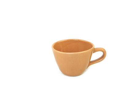 Side view, empty brwon mug isolated on white background. Blank  brown ceramic cup mockup and template for design, and banner. Use for home or restaurantの写真素材