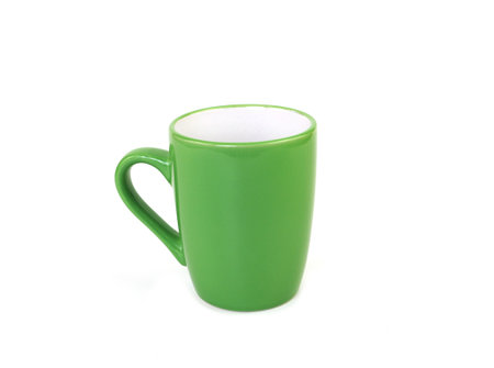 Side view, empty green mug isolated on white background. Blank green ceramic cup mockup and template for design, and banner. Use for home or restaurantの写真素材