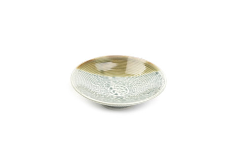 Light green-dark green round ceramic serving plate isolated on a white background. Template for food design, and banner. Use for home or restaurant. Side view.の写真素材