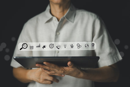 Businessman holding a tablet digital show virtual screen search bar  SEO (Search Engine Optimization), online marketing, business growth, customer service, e-commerce, global and location services.の写真素材