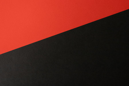 Black and red colored paper background texture, Two tones, Concept for image, text, design. Geometric paper backdrop.の写真素材