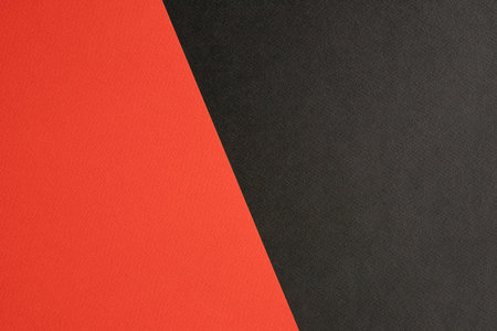 Black and red colored paper background texture, Two tones, Concept for image, text, design. Geometric paper backdrop.の写真素材