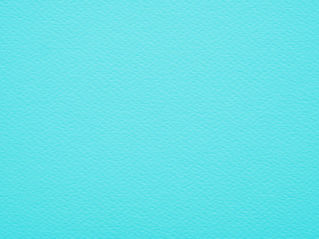 Close-up, straight-on shot of a solid, blue paper has a visible, slightly rough texture with small,...