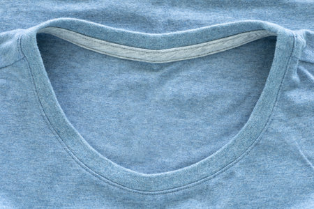 Top view, close-up shot of the neck cotton light blue color. Fashion design concept of t-shirt, your product. Textile concept and soft backdrop.の写真素材