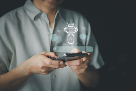 A person holds a smartphone with an AI chatbot interface overlay, symbolizing the integration of artificial intelligence into daily life and mobile technology. Concept of digital communication.の写真素材