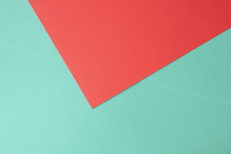 Concept for image, text, and design. Geometric paper backdrop. Two-tone color green and red colored...