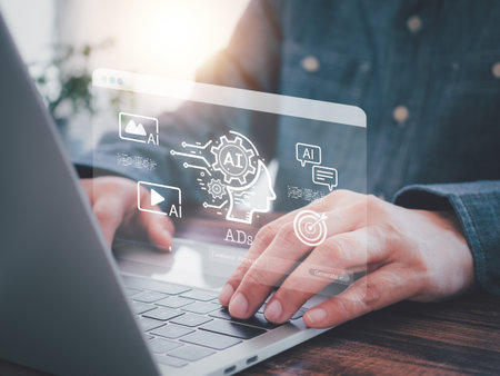 AI-powered marketing strategies, data analysis, and innovative advertising. A person using laptop, interacting with holographic show AI and Ad icons. Online media, the future of advertising.の写真素材