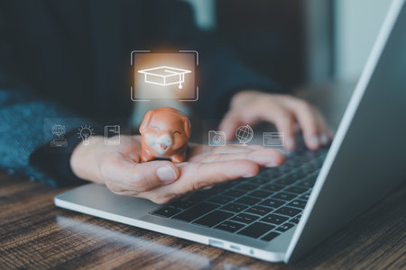 Person saving money in a piggy bank for an education fund. Financial planning for university tuition, college scholarships, and student loans. Investment in knowledge for a successful future career.の写真素材