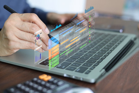 A manager professional's hand using a stylus on a futuristic virtual screen, analyzing project management dashboard with a Gantt chart and data analytics for strategic plan and performance trackingの写真素材