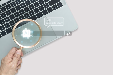 Concept AI search and machine learning research. Hand of magnifying glass over a stylized AI icon and search bar. Digital transformation future innovation in business and data analysis.の写真素材