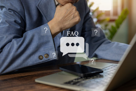 Businessman using phone with FAQ icon and question marks. Concept of customer support, online help...