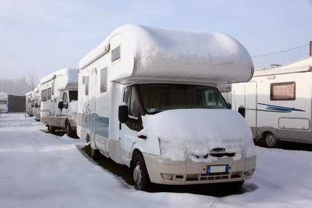 motorhome and caravan at winter with snowのeditorial素材