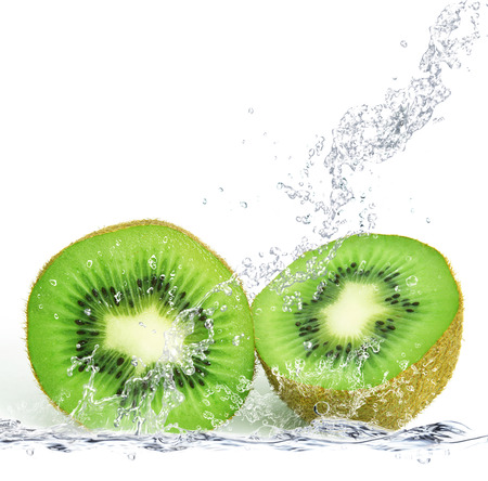 fresh kiwi falling in waterの写真素材