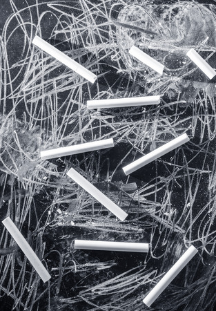 white chalks on black backgroundの写真素材