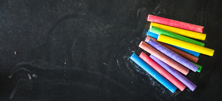coloured chalks on black backgroundの写真素材