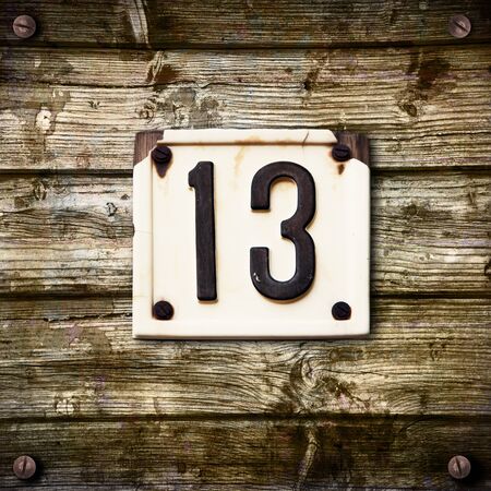Number 13 on a wooden backgroundの写真素材