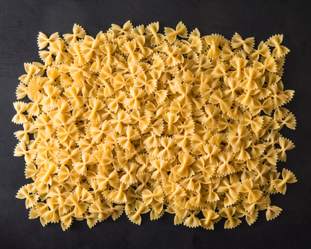original italian pasta on black background