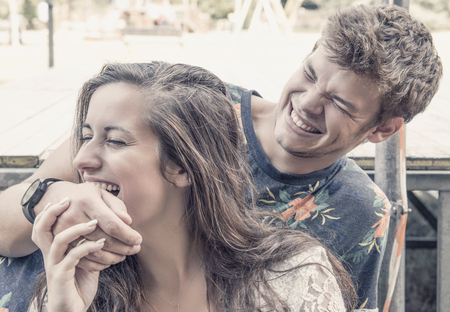 young couple has fun in the parkの写真素材