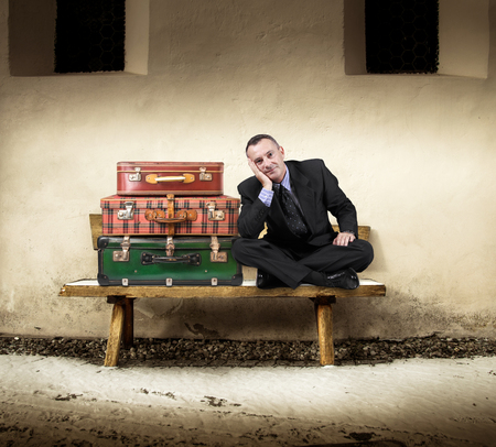 manager sitting on a wood benchの写真素材