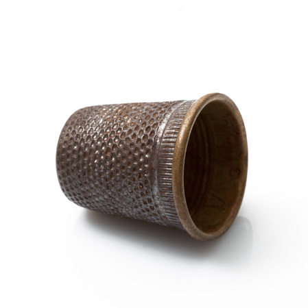 old thimble for seamstress on white backgroundの写真素材