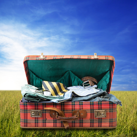 Old suitcase on sky backgroundの写真素材