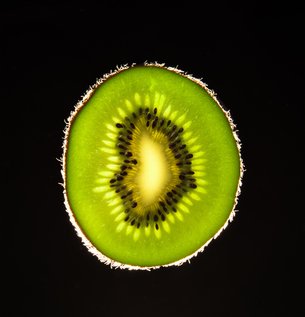 fresh slice kiwi in backlightの写真素材
