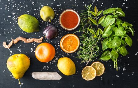 gastronomy situation with spices and ingredients on dark backgroundの写真素材