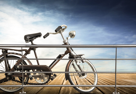 isolated bicycle on wooden sidewalkの写真素材