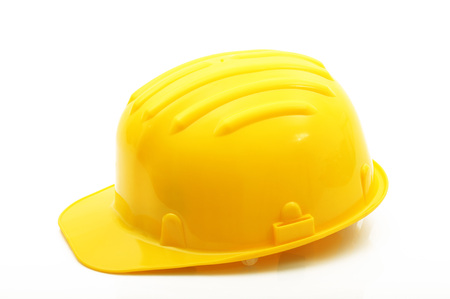 yellow classic safety helmet on white backgroundの写真素材