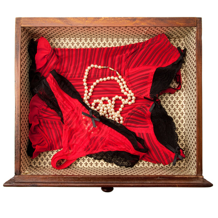 Drawer with clothes seen from above on white backgroundの写真素材