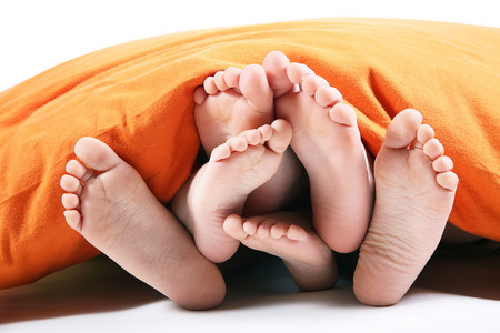 six feet under the blanket on white backgroundの写真素材