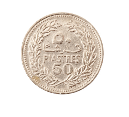 vintage metal coin on white backgroundの写真素材