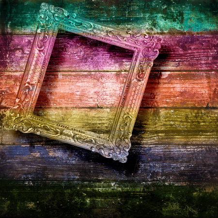Old frame hanging on wooden wallの写真素材