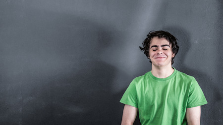 A little boy smiling satisfiedの写真素材