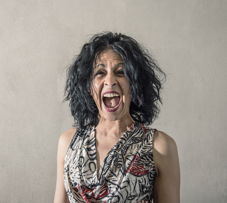 a Very stressed woman screamingの写真素材