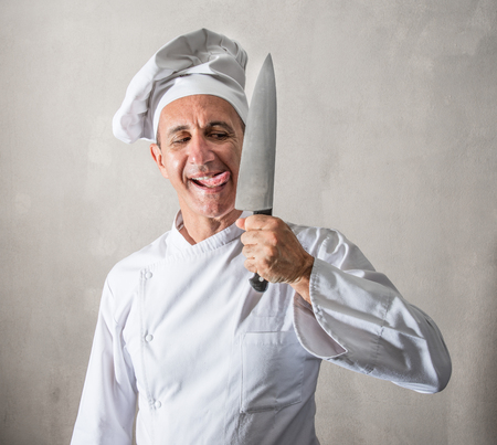 a crazy cook licking a knife
