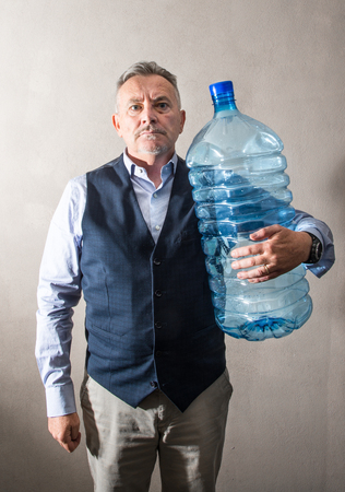 a man with a giant water bottleの写真素材